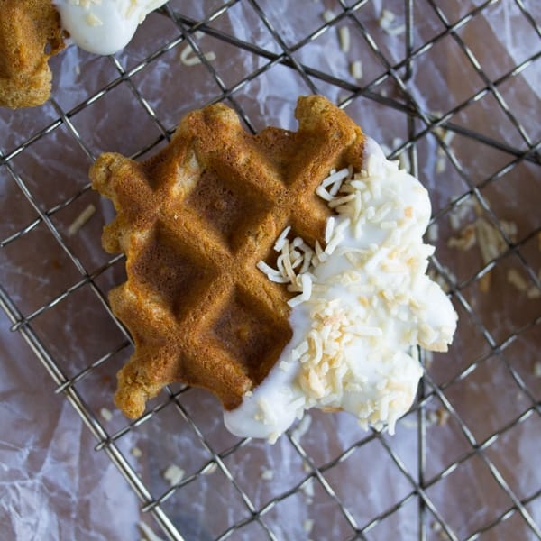 close up overhead view of carrot cake waffle bite on wire rack