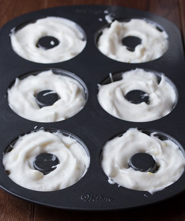 lemon angel food donut batter in donut pan before baking