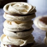 stack of coffee nutella meringue sandwiches on parchment