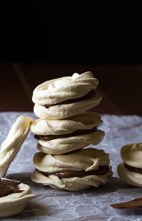 stack of three nutella coffee meringue cookies on wax paper