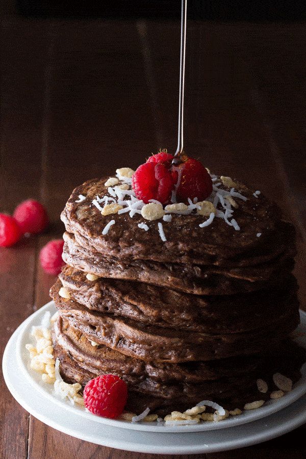 animated GIF showing maple syrup drizzling onto a stack of chocolate rice krispie pancakes