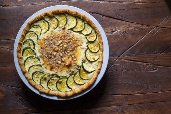 overhead view of zucchini ricotta quiche in pie plate