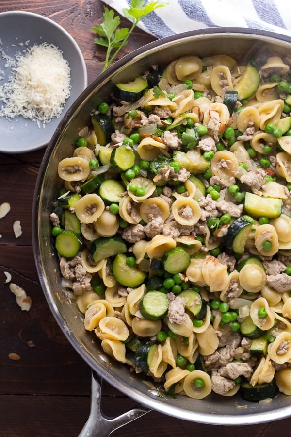 overhead view of orecchiette with zucchini, ground turkey and peas