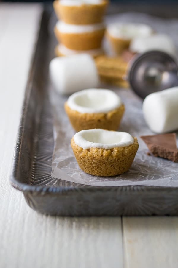 Ice Cream Cookie Cup shells on a sheet pan before adding in the ice cream