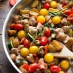 overhead shot of balsamic chicken skillet with wood spoon