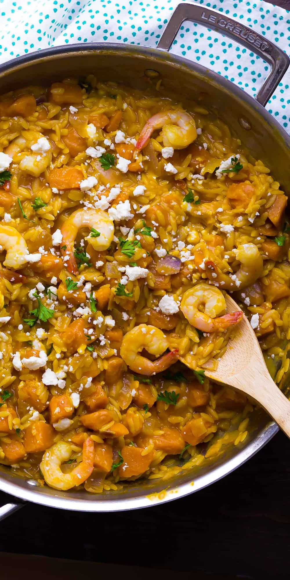 overhead shot of shrimp and squash orzo in skillet