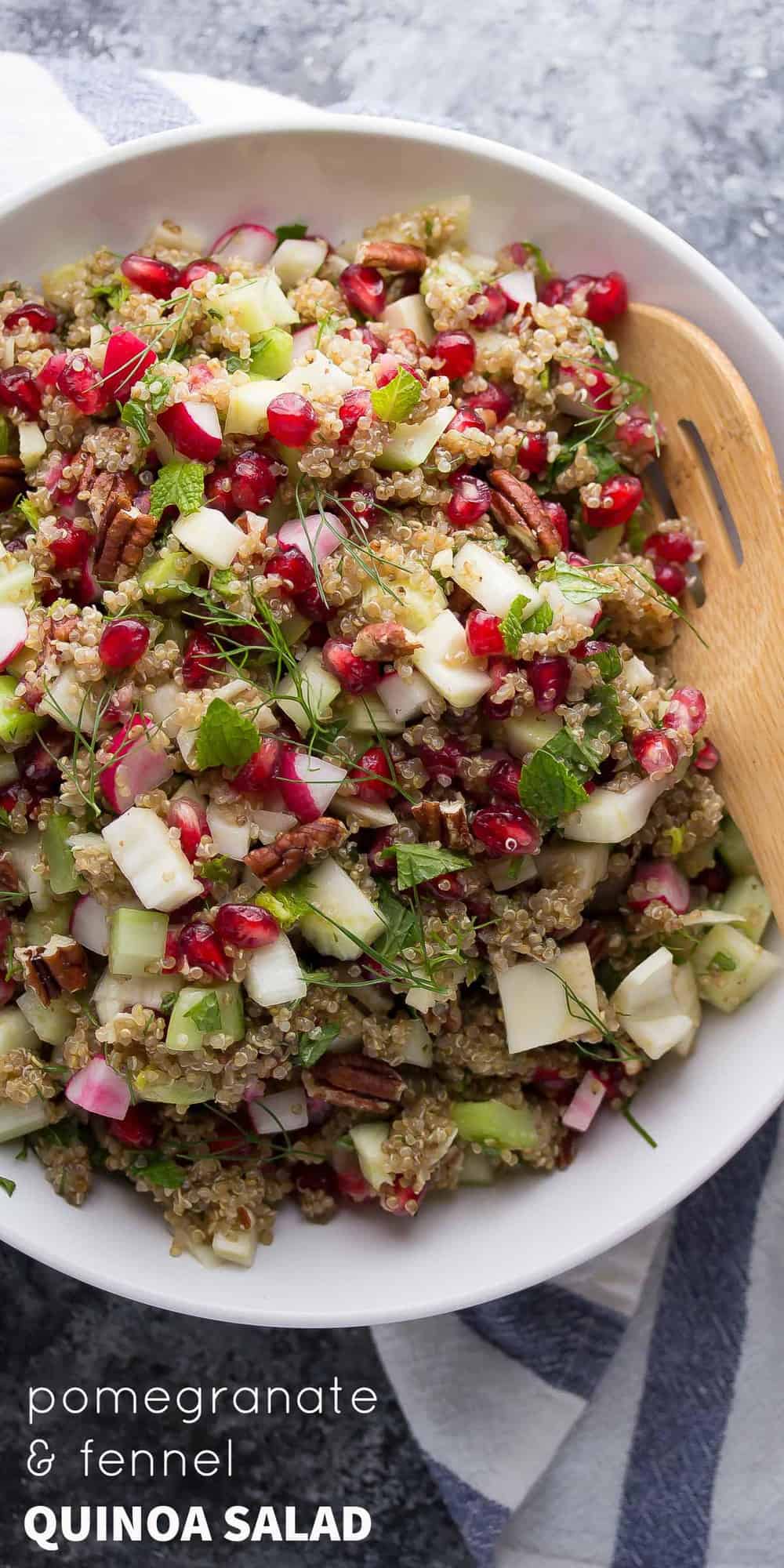 pomegranate fennel quinoa salad in white bowl