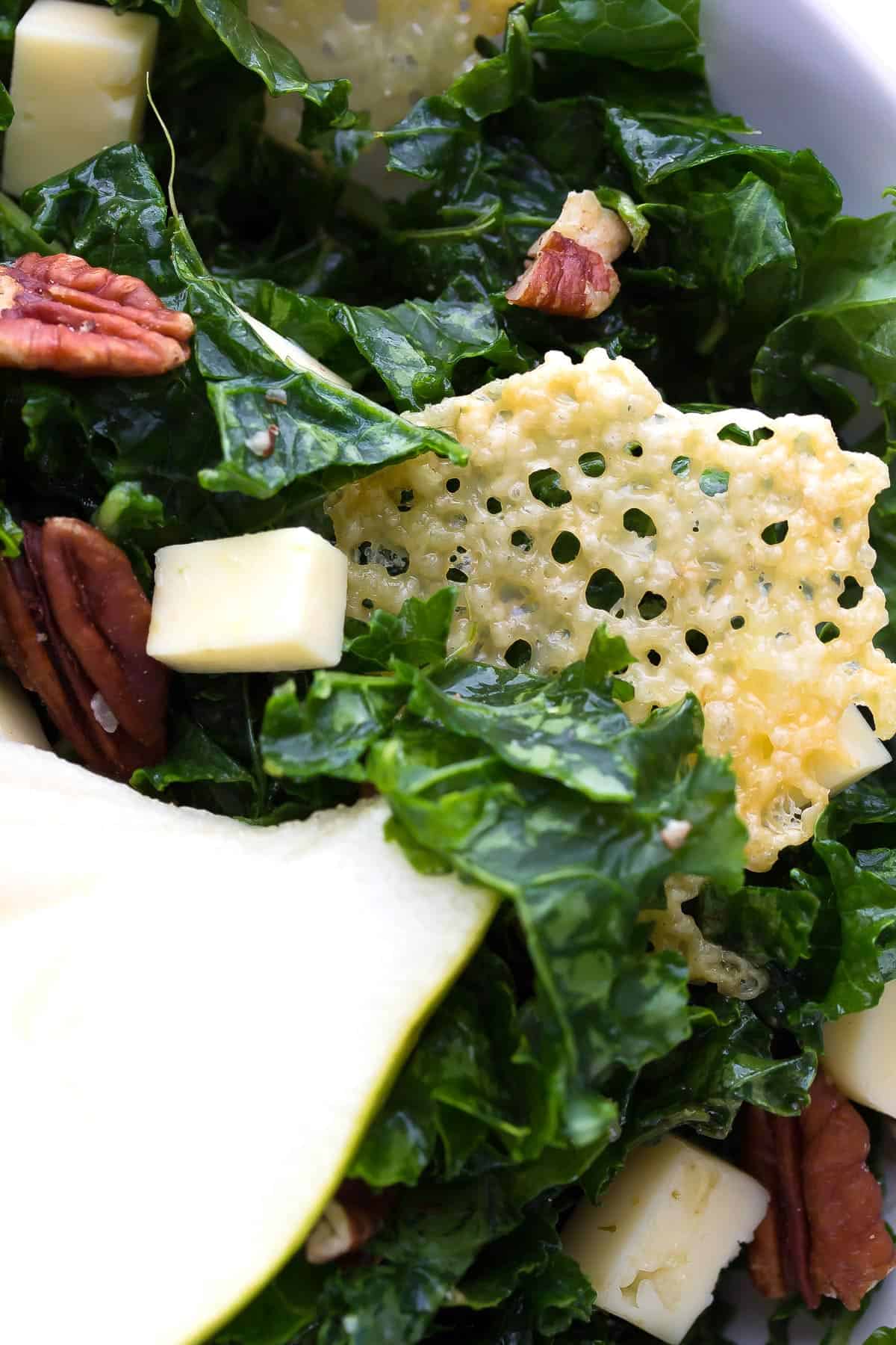 close up view of havarti crisp in kale salad