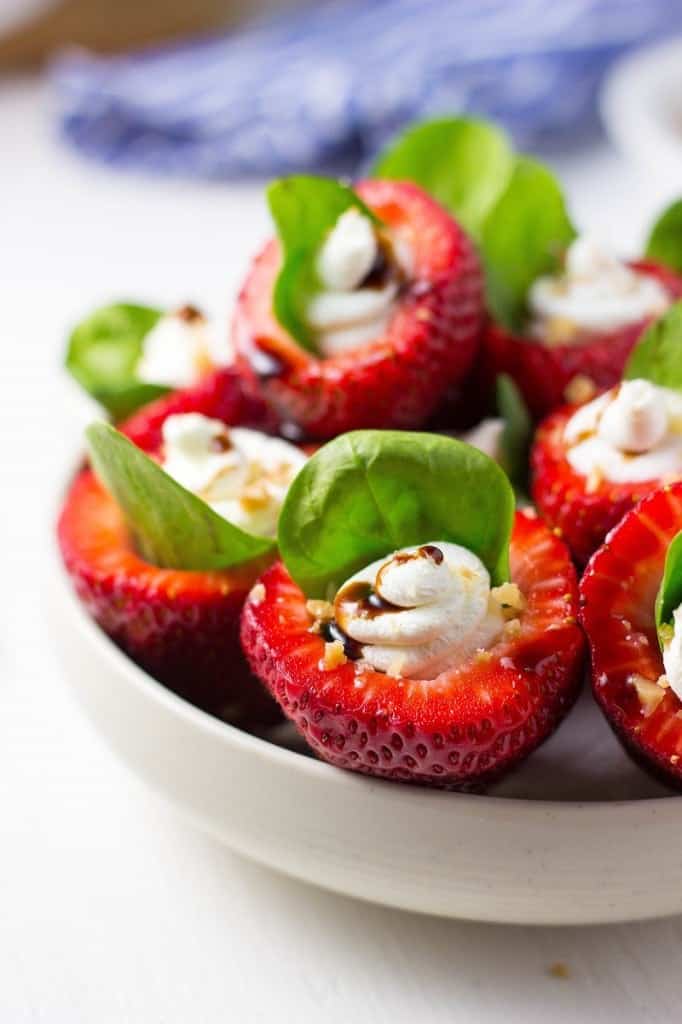 goat cheese stuffed strawberries in bowl