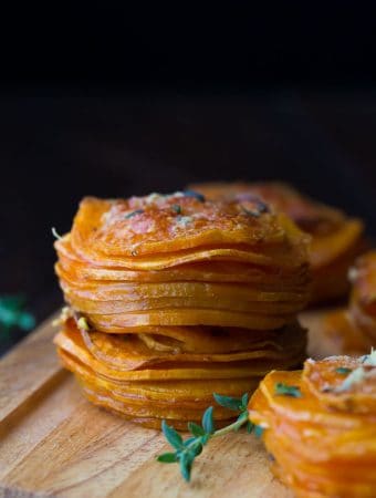 herb coconut oil sweet potato stacks on wood board