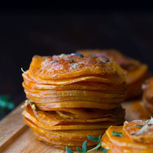 herb coconut oil sweet potato stacks on wood board