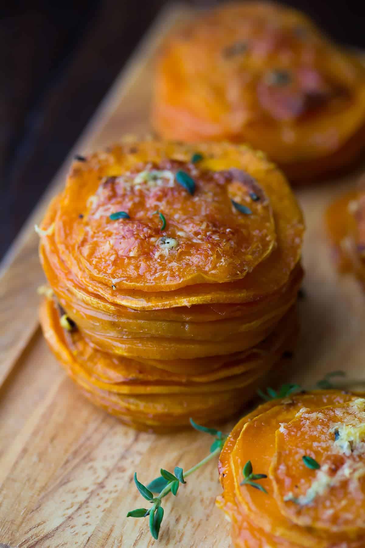sweet potato stacks on cutting board; showing crispy tops of stacks