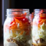 two mason jars filled with asian chicken salads