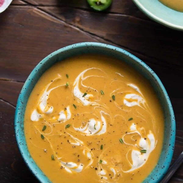 overhead shot of spicy caribbean sweet potato soup in blue bowl