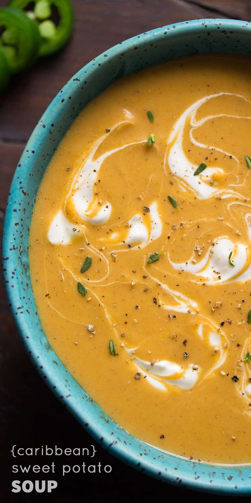 close up view of spicy caribbean inspired sweet potato soup in blue bowl
