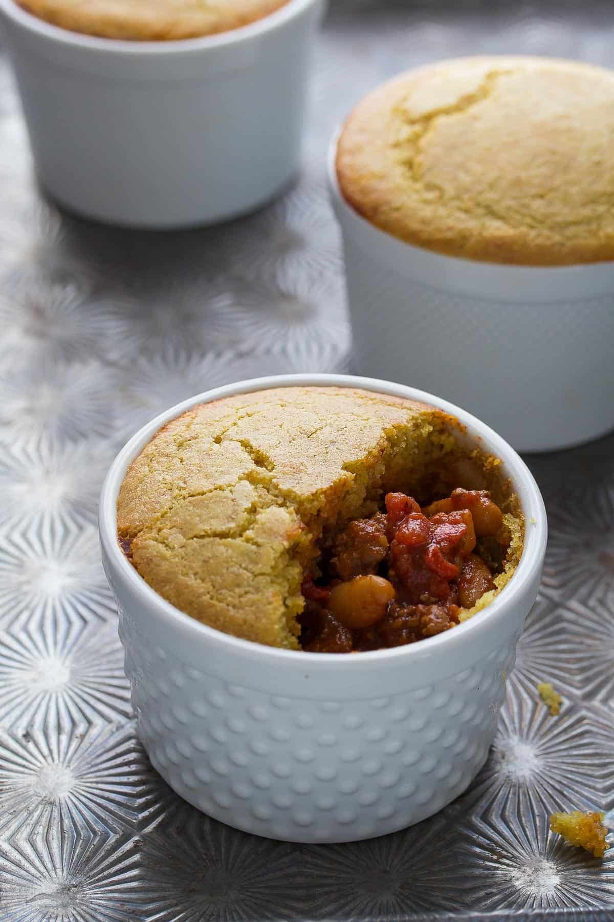 A simple recipe to use up leftover chili! Baked up in a personal-sized portion, and topped with a delicious cornbread topping!