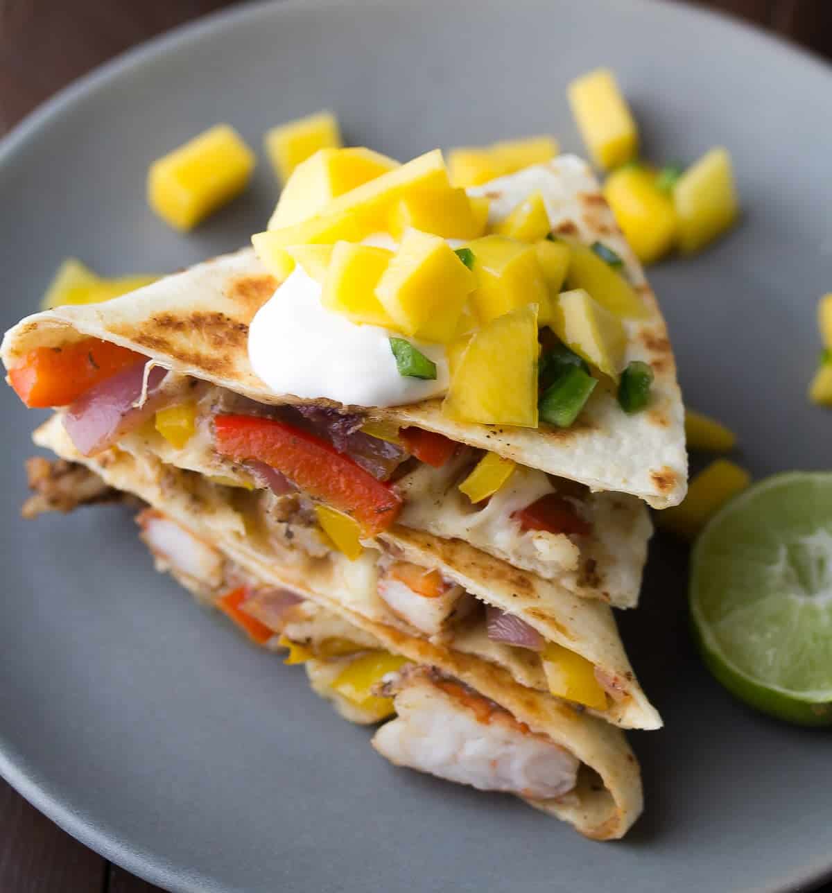 Spicy Shrimp Quesadillas with Mango Salsa, a delicious 30 minute dinner recipe that has a ton of fresh fruit and vegetables!