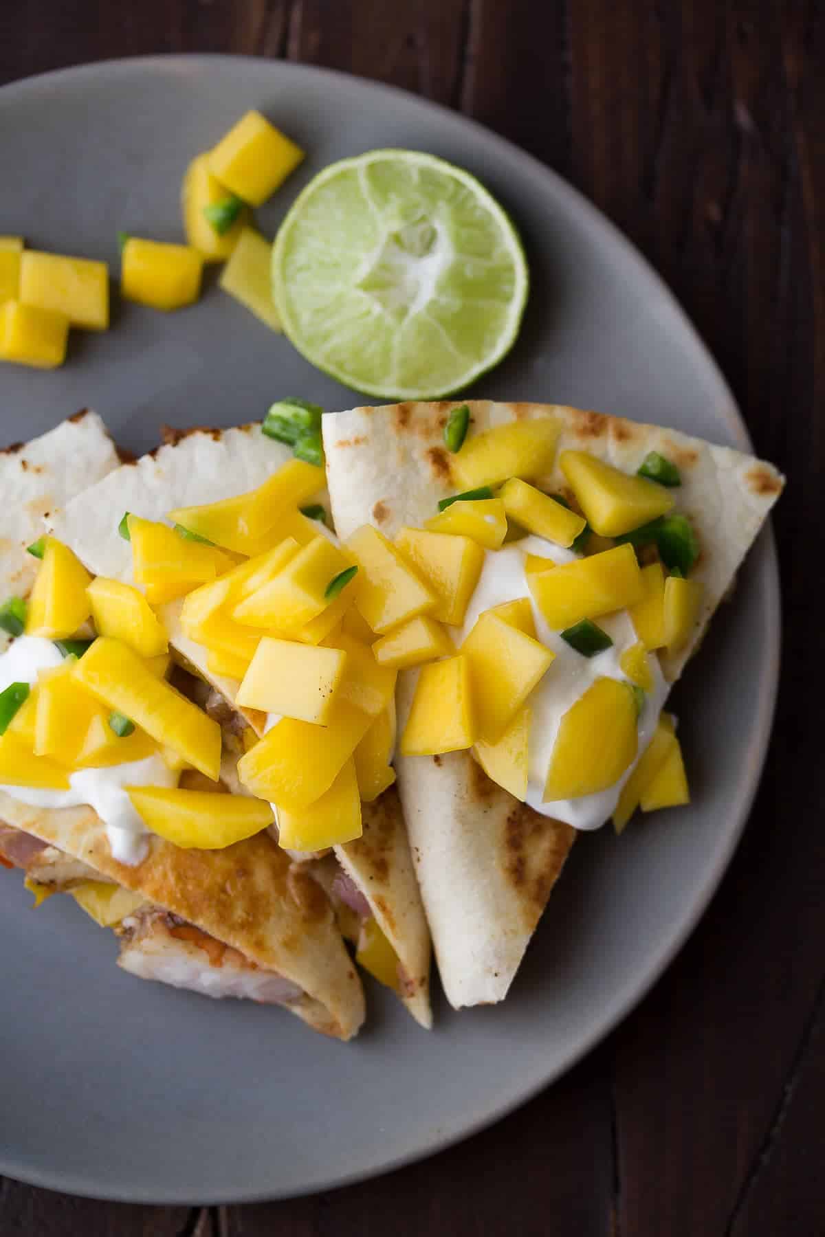 Spicy Shrimp Quesadillas with Mango Salsa, a delicious 30 minute dinner recipe that has a ton of fresh fruit and vegetables!