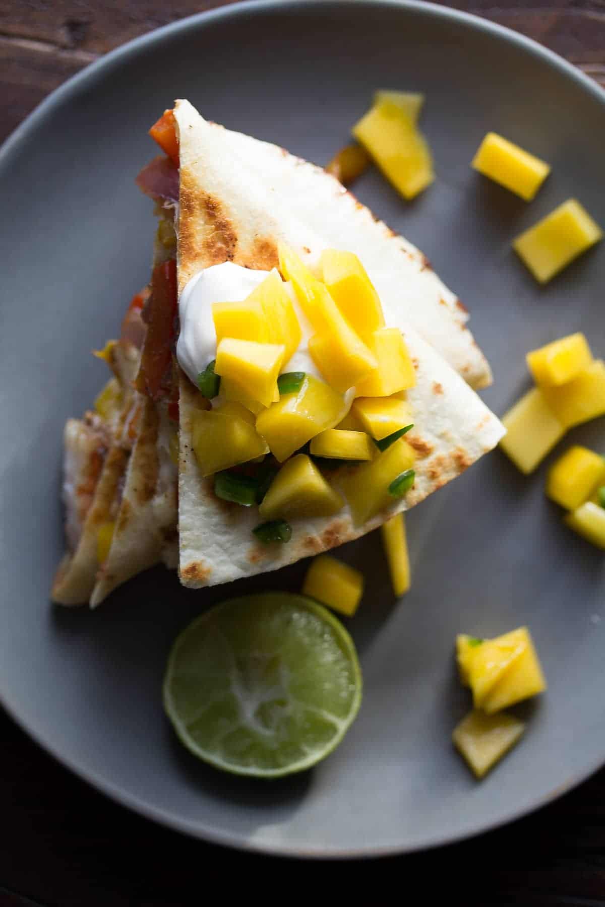 Spicy Shrimp Quesadillas with Mango Salsa, a delicious 30 minute dinner recipe that has a ton of fresh fruit and vegetables!