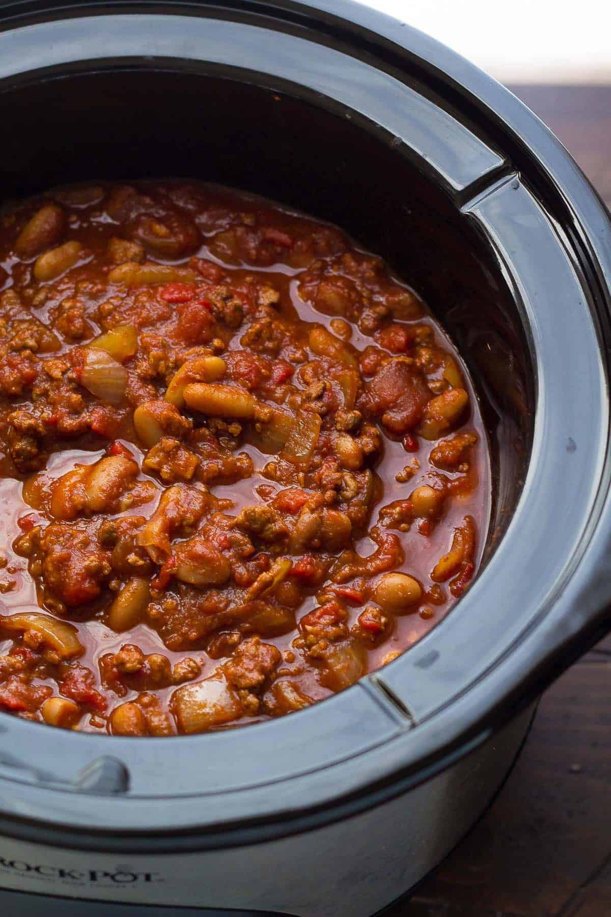 Close up view of cooked roasted red pepper chili in the slow cooker after cooking.