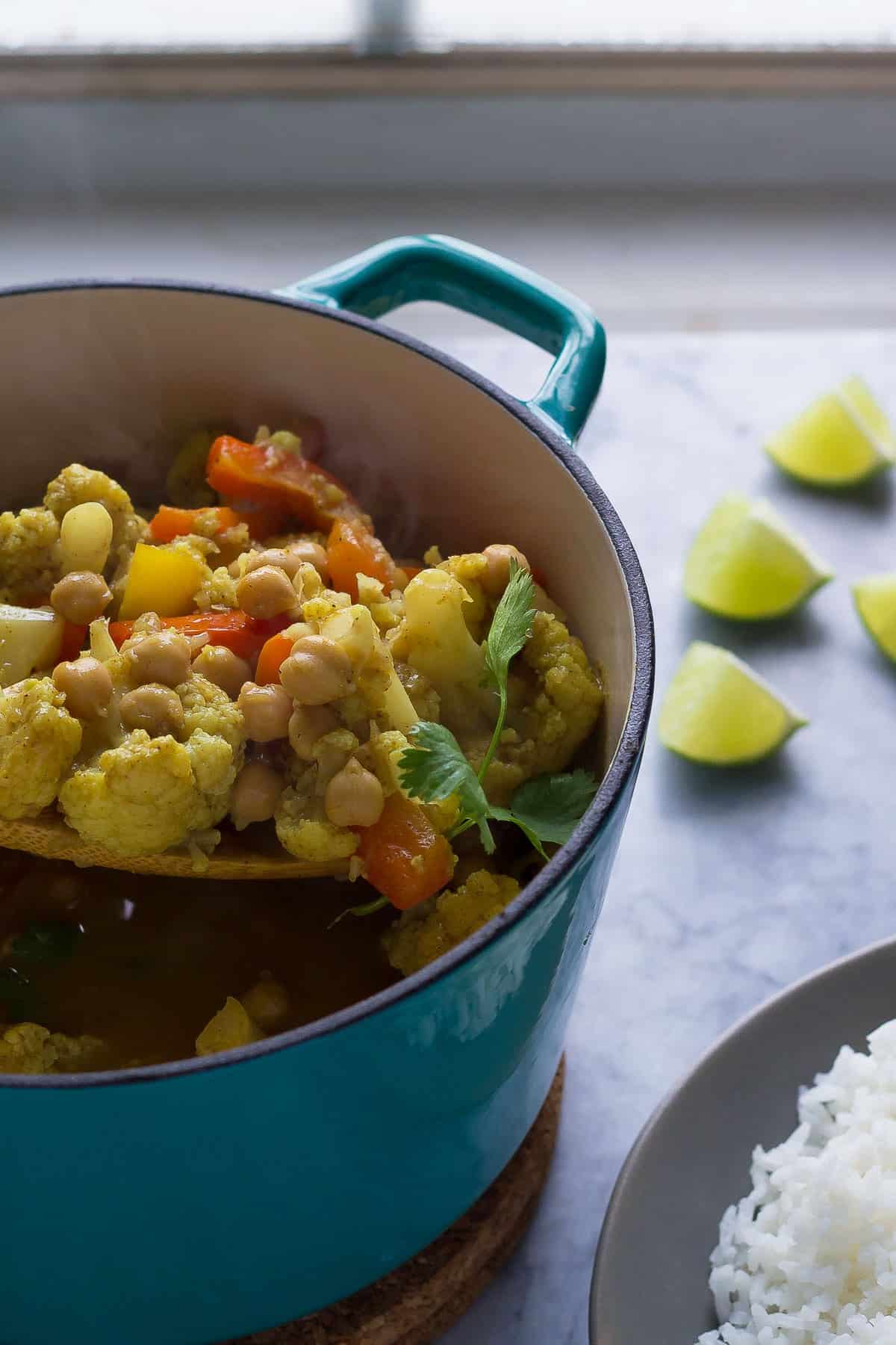 This chickpea & cauliflower vegan curry is bright and flavorful, and is easy enough for a week-night dinner!