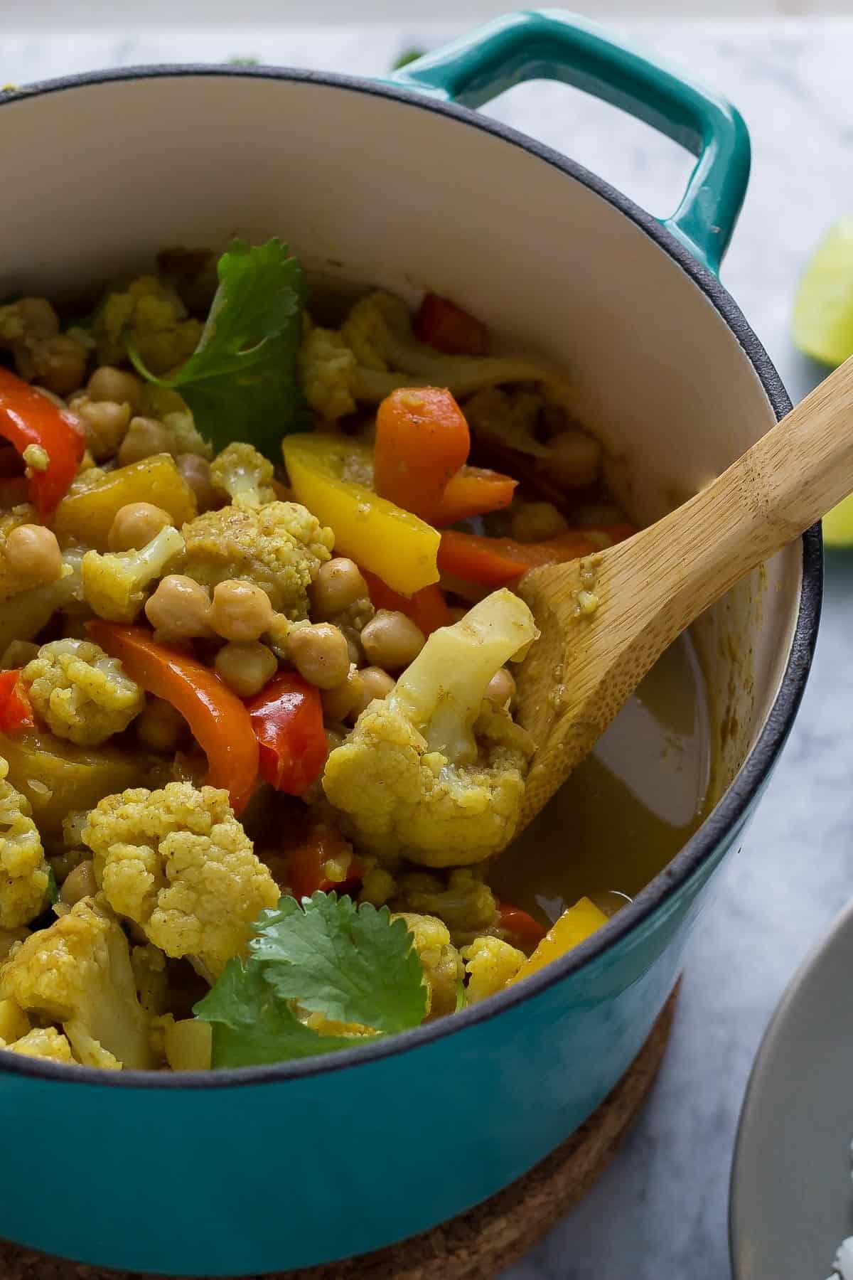 This chickpea & cauliflower vegan curry is bright and flavorful, and is easy enough for a week-night dinner!