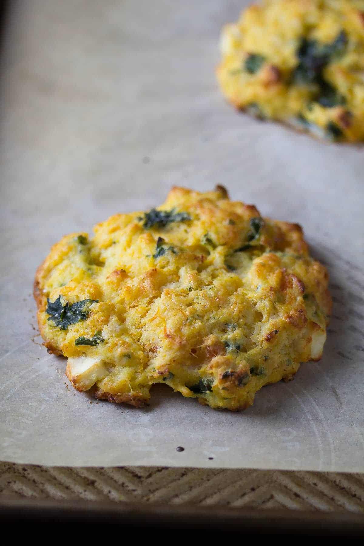 close up shot of butternut squash scone on a baking sheet