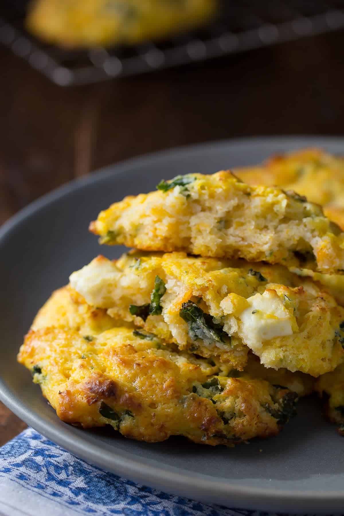 butternut squash scones piled on a plate with one broken open