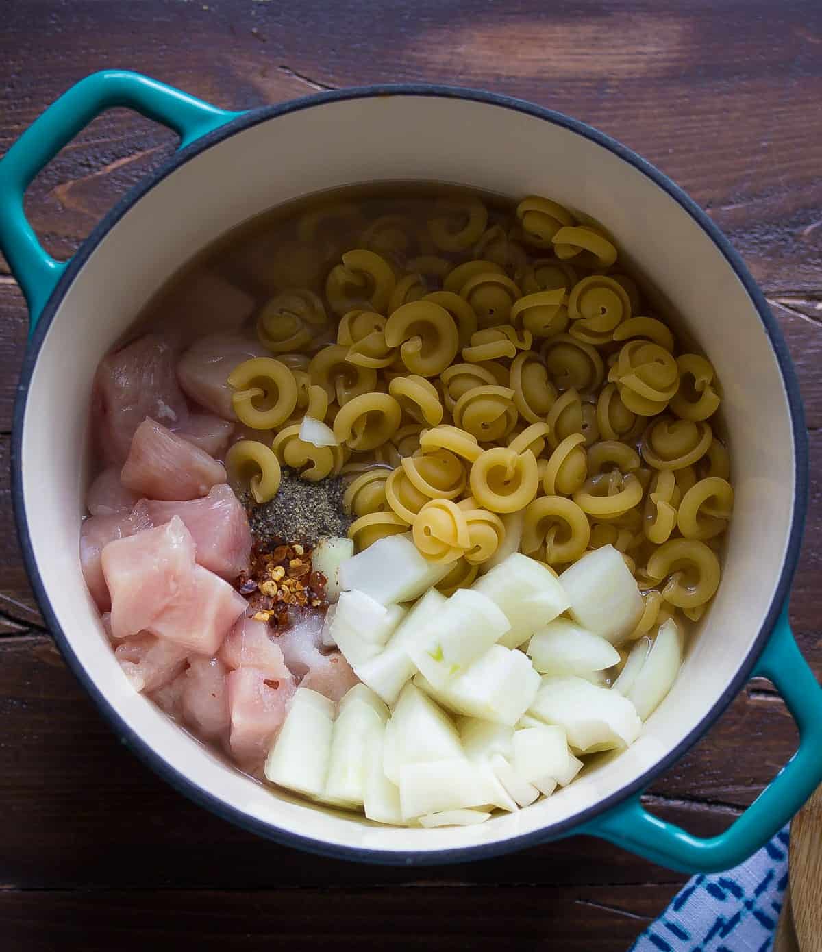 One Pot Pasta with Kale, Goat Cheese, Chicken and Pine Nuts. An easy week-night dinner recipe that is ready in 30 minutes! 