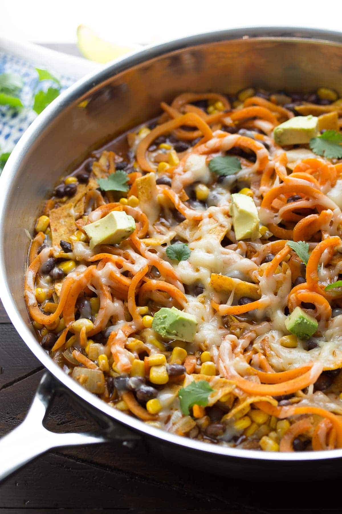 Side angle view of sweet potato noodles recipe in skillet