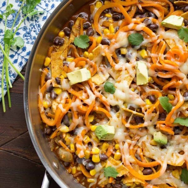 overhead shot of enchilada sweet potato noodles skillet in large pan on table