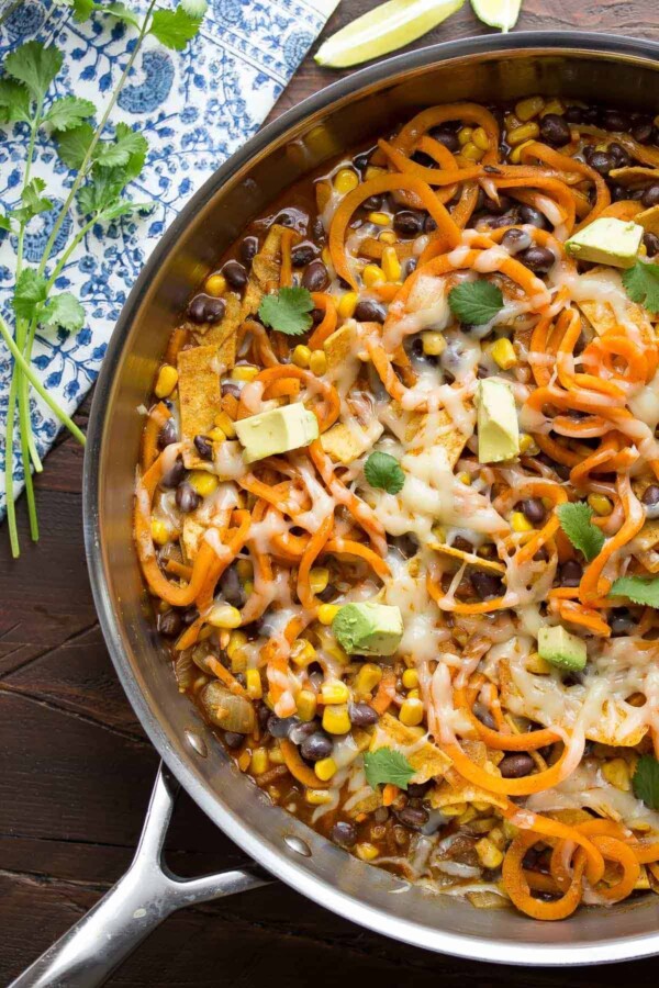 overhead shot of enchilada sweet potato noodles skillet in large pan on table