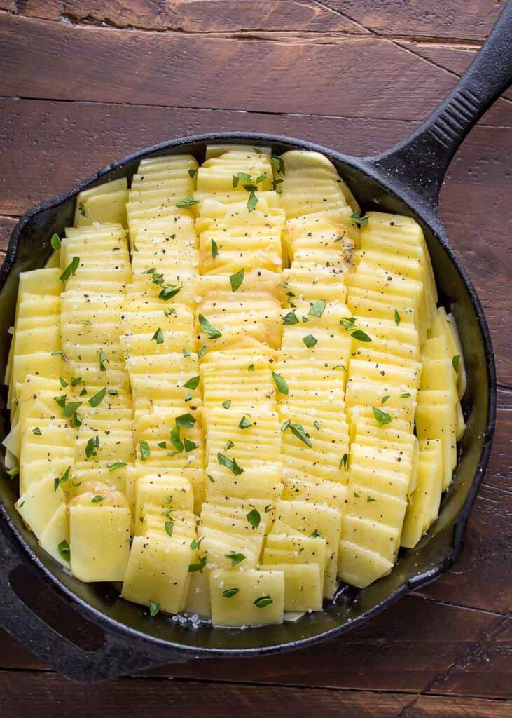 domino potatoes in a dish unbaked