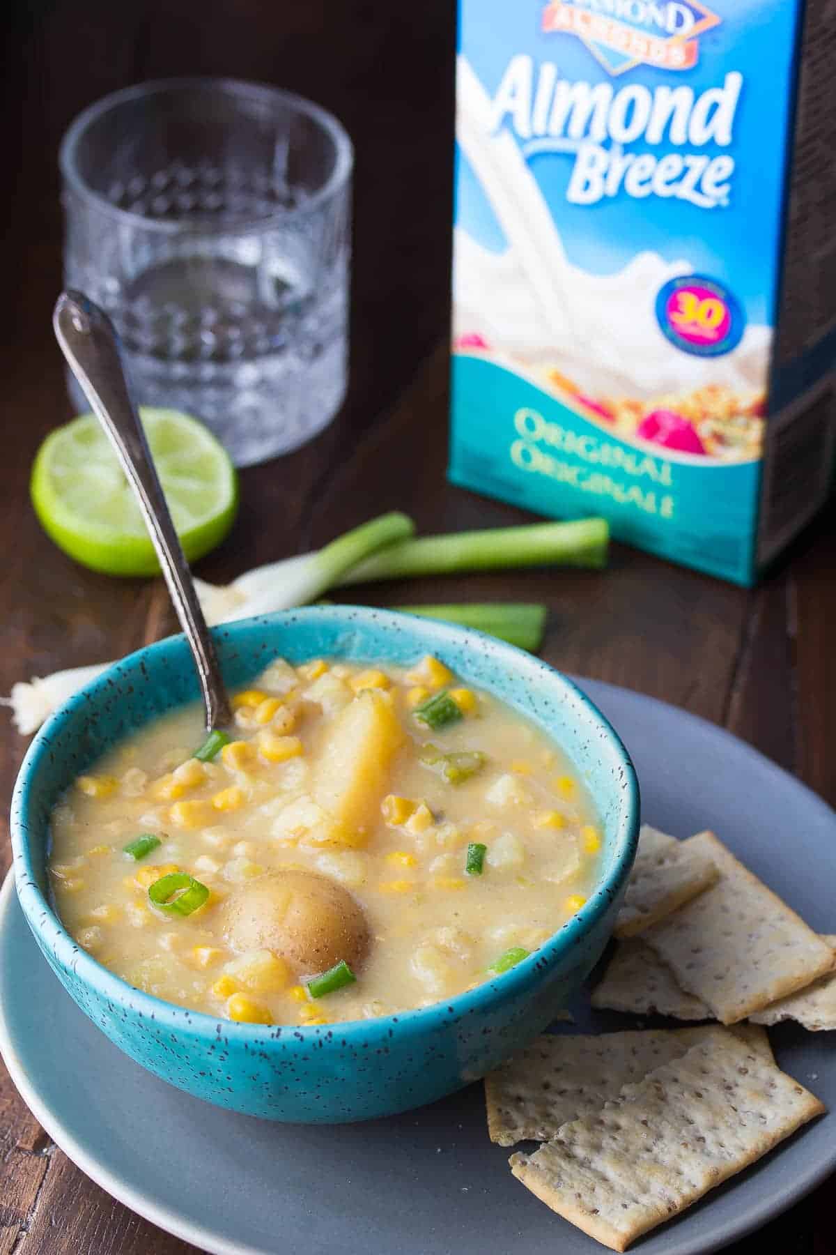 This slow cooker potato corn soup is an easy and deceptively healthy recipe that gets a boost of creaminess from Almond Breeze almond beverage, and a touch of heat from jalapenos! Only 160 calories/bowl!