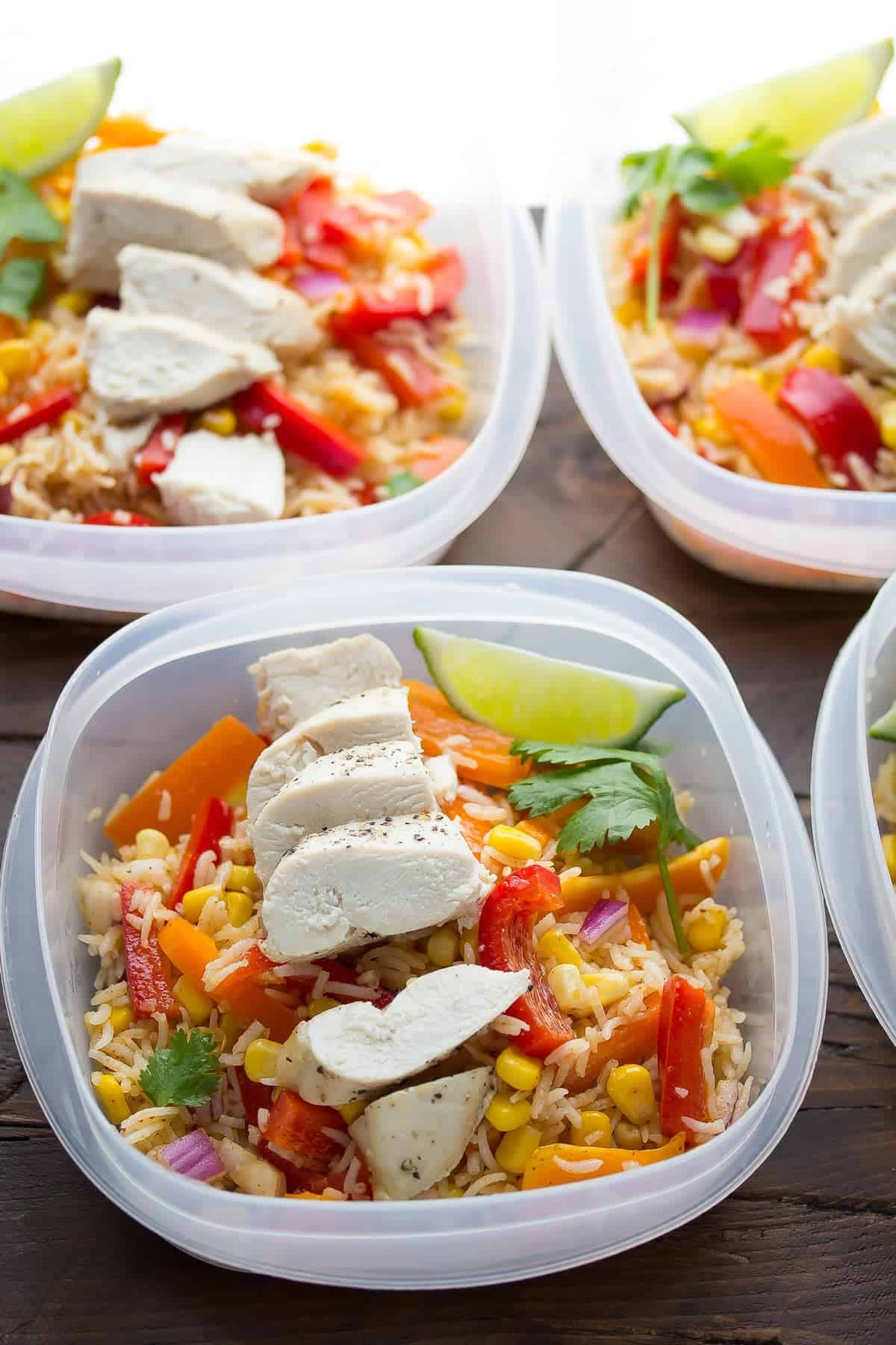 side angle view of three chicken fajita lunch bowls