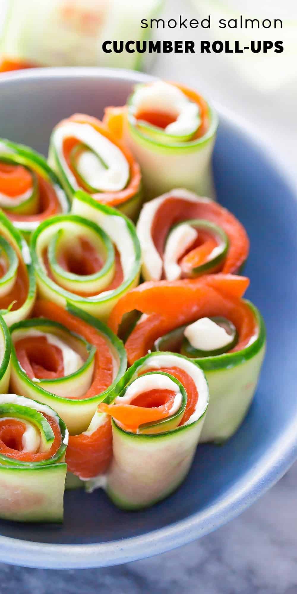 close up of Smoked salmon roll ups in a blue bowl