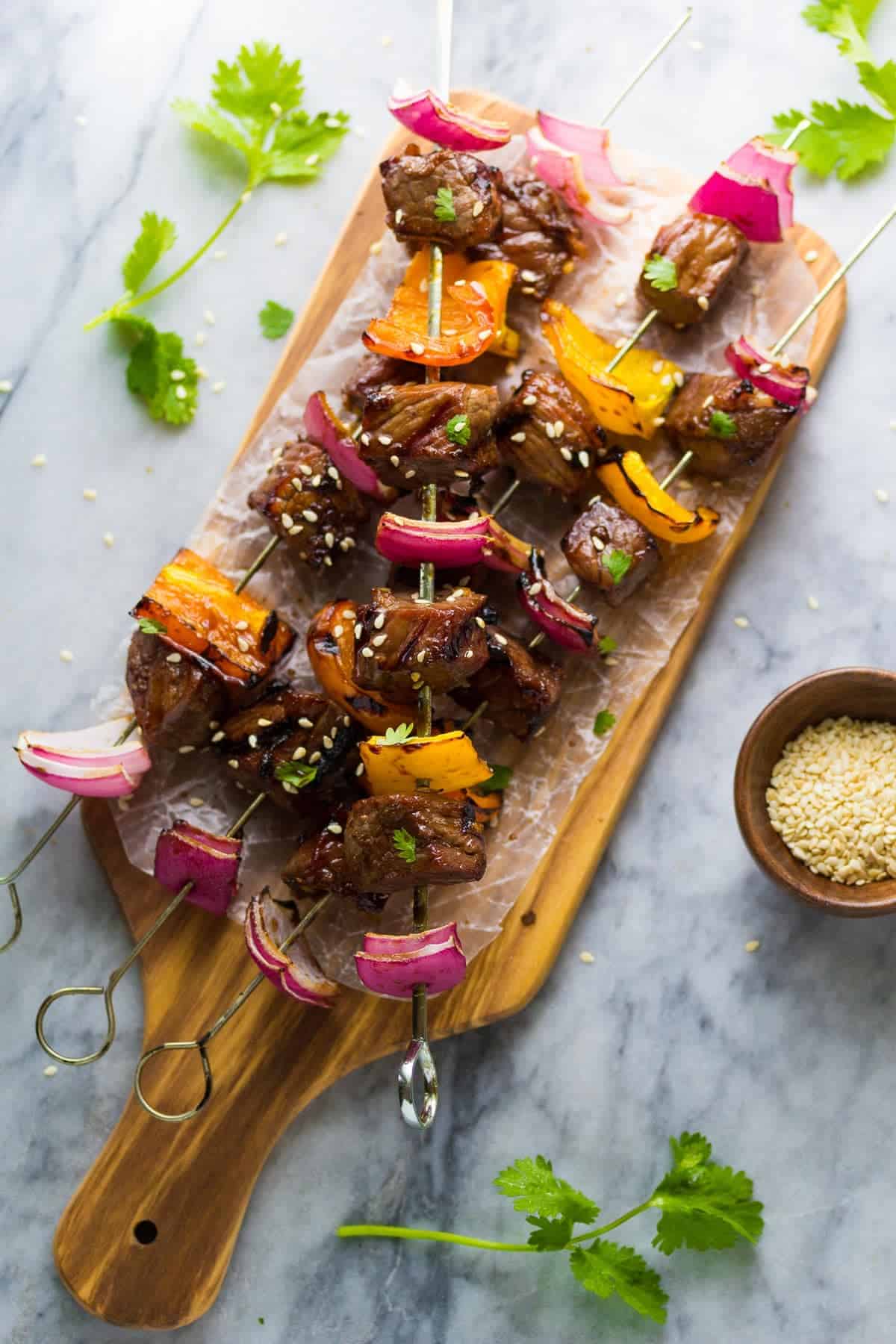 Grilled Korean Beef Skewers on a cutting board