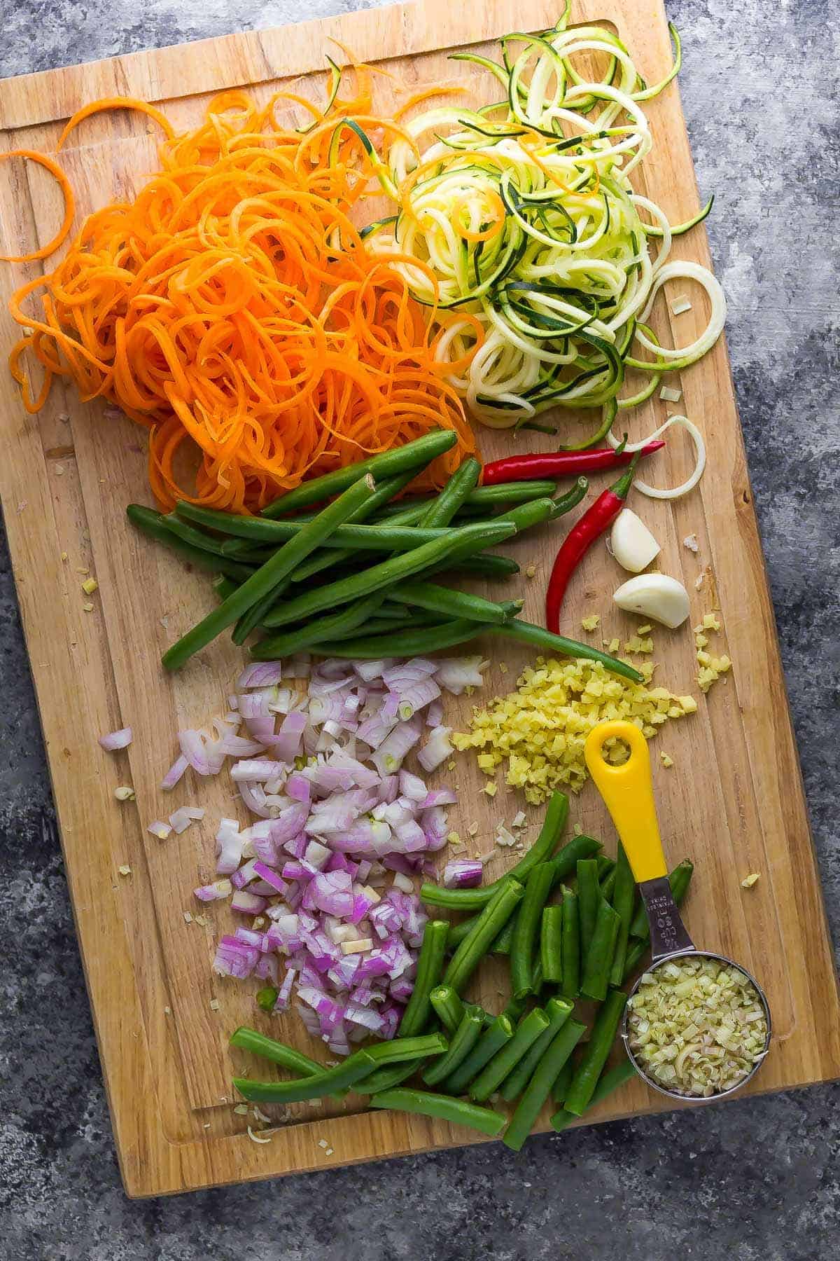 Chopped and prepared stir fry vegetables on a chopping board