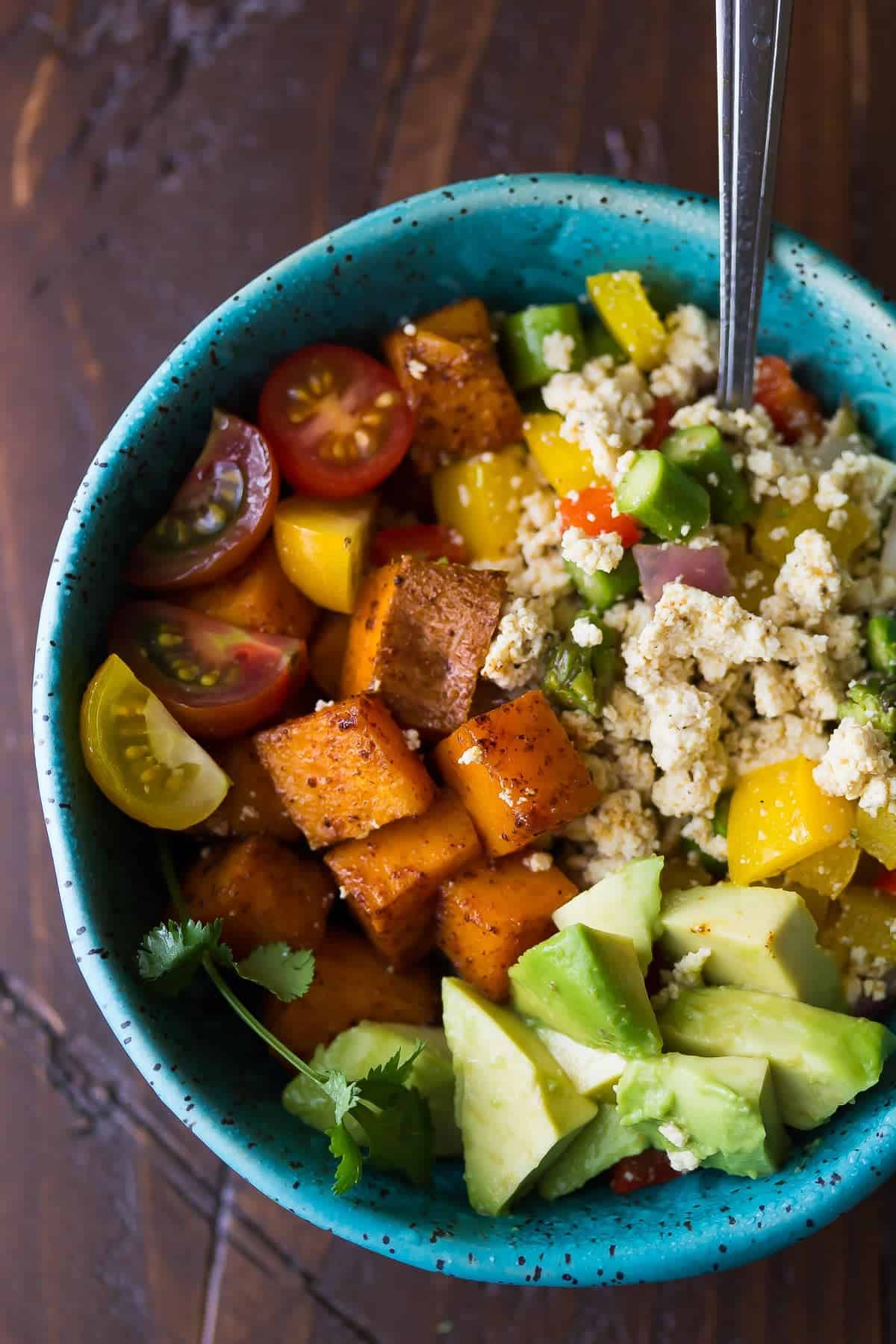 Tofu Scramble & Breakfast Sweet Potatoes with avocado in a blue bowl