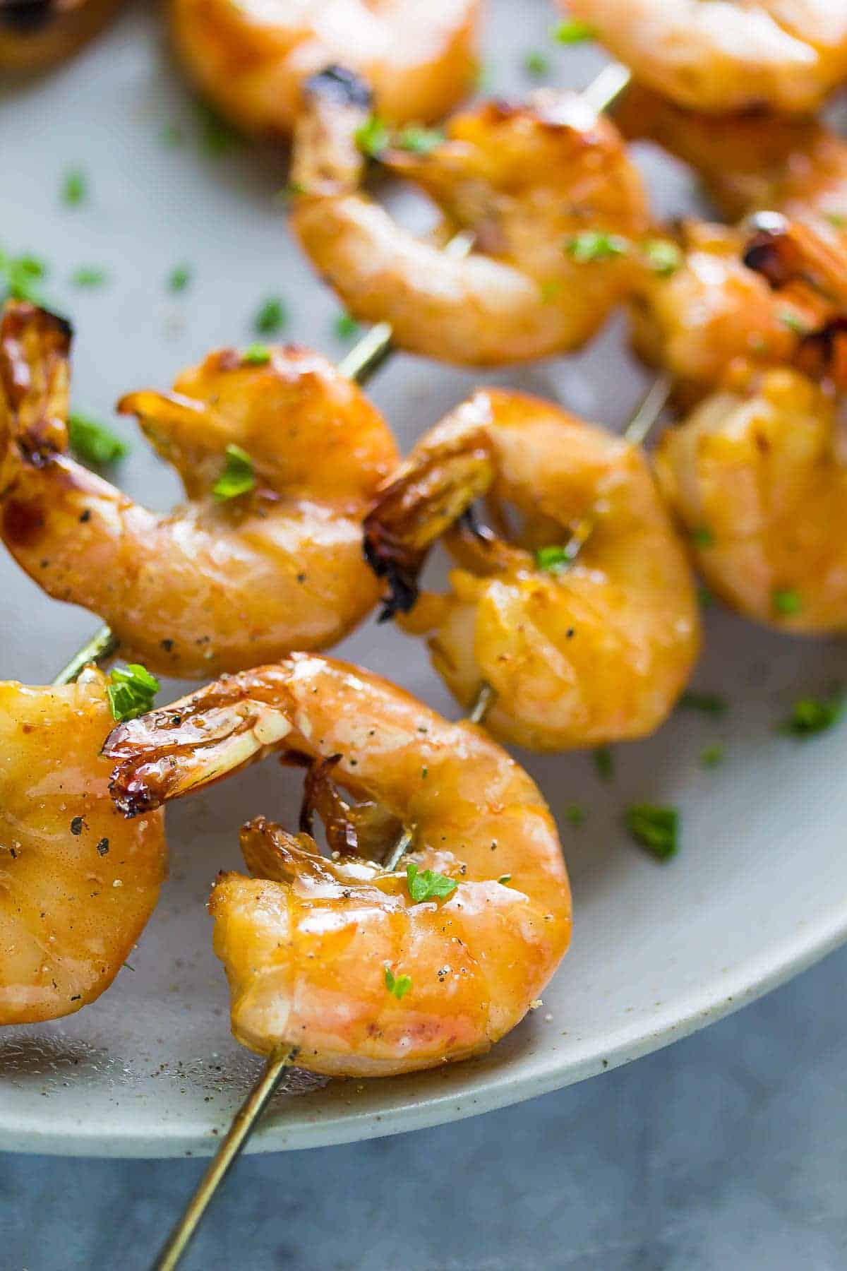 close up shot of cooked Chipotle Grilled Shrimp Skewers on a plate