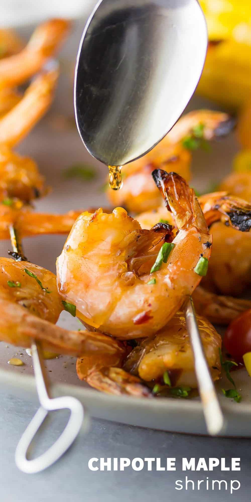 Chipotle Grilled Shrimp Skewers with Maple Glaze being drizzled over 