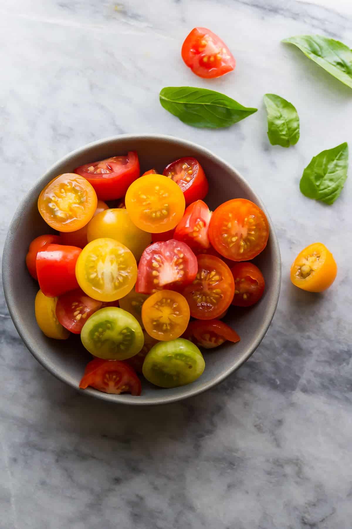 Ingredients shot of cherry tomatoes and fresh basil