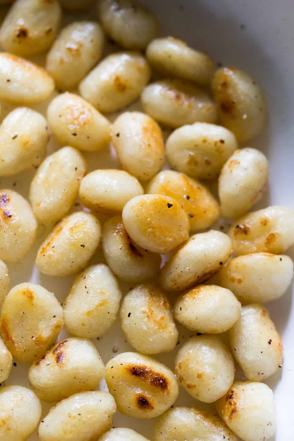 Ingredients shot of gnocchi in a skillet