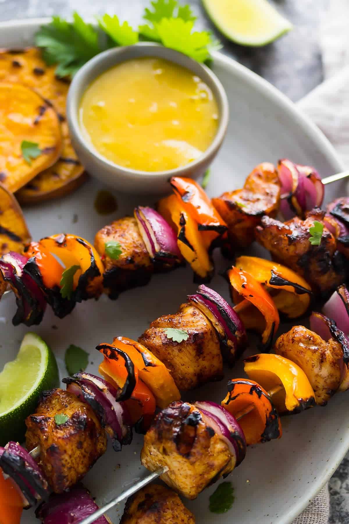 Plated grilled Chili Lime Chicken Skewers with Mango Sauce
