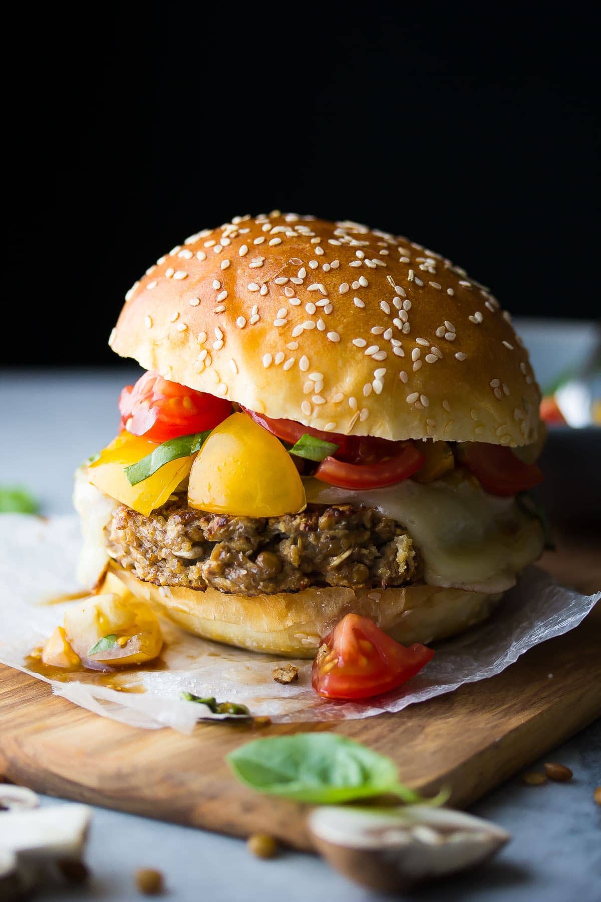 side angle view of Mushroom and Lentil Bruschetta Burger plated with a bun