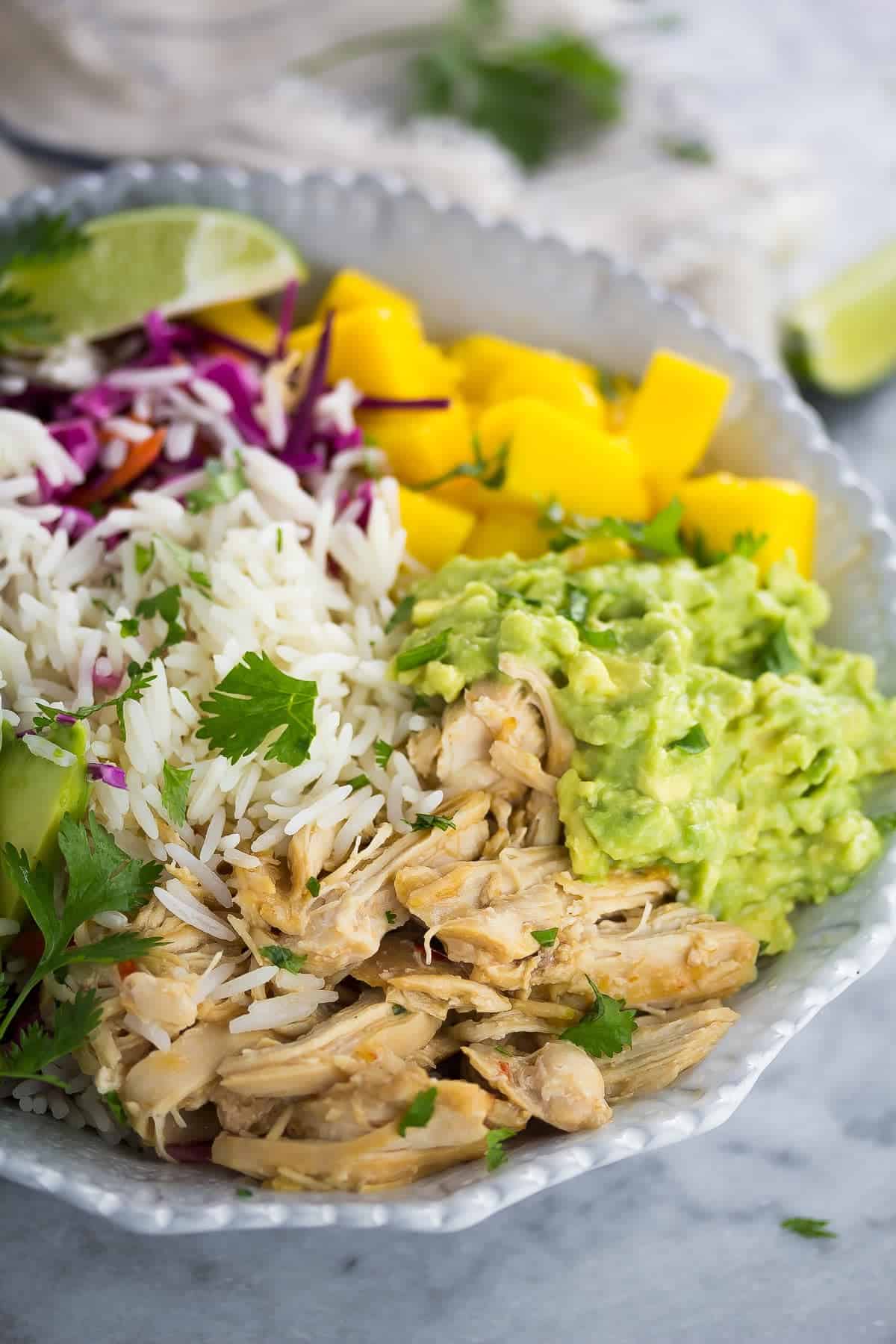 side angle close up view of overhead view of sweet chili chicken rice bowls 