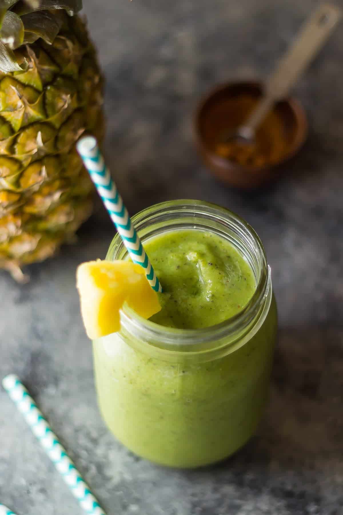 pineapple smoothie in mason jar with straw