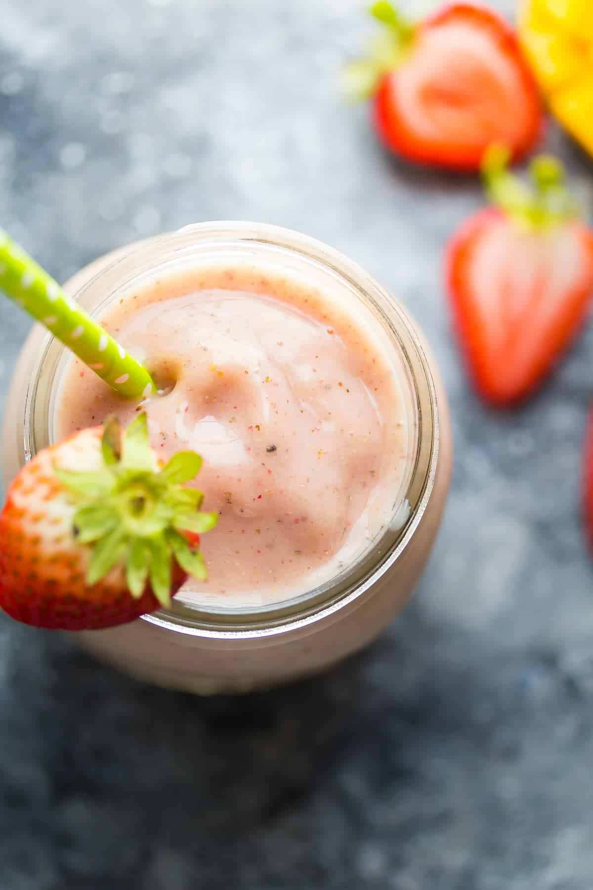 close up shot of chai spiced strawberry mango smoothie in jar