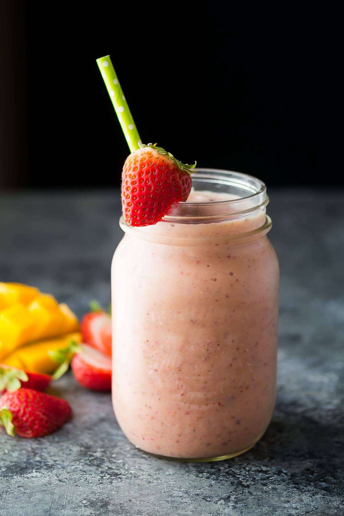 side view of strawberry mango smoothie