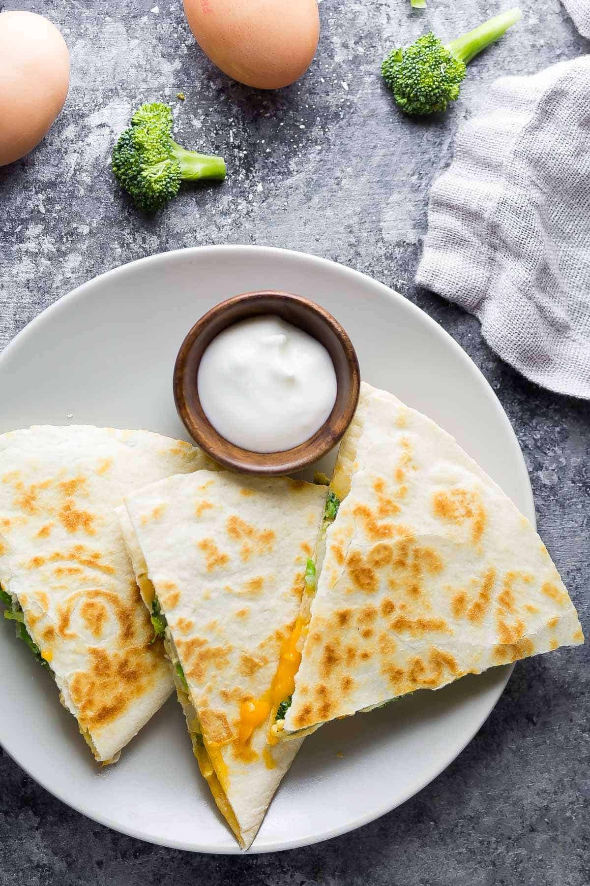 overhead view of Broccoli Cheddar Breakfast Quesadillas on a plate